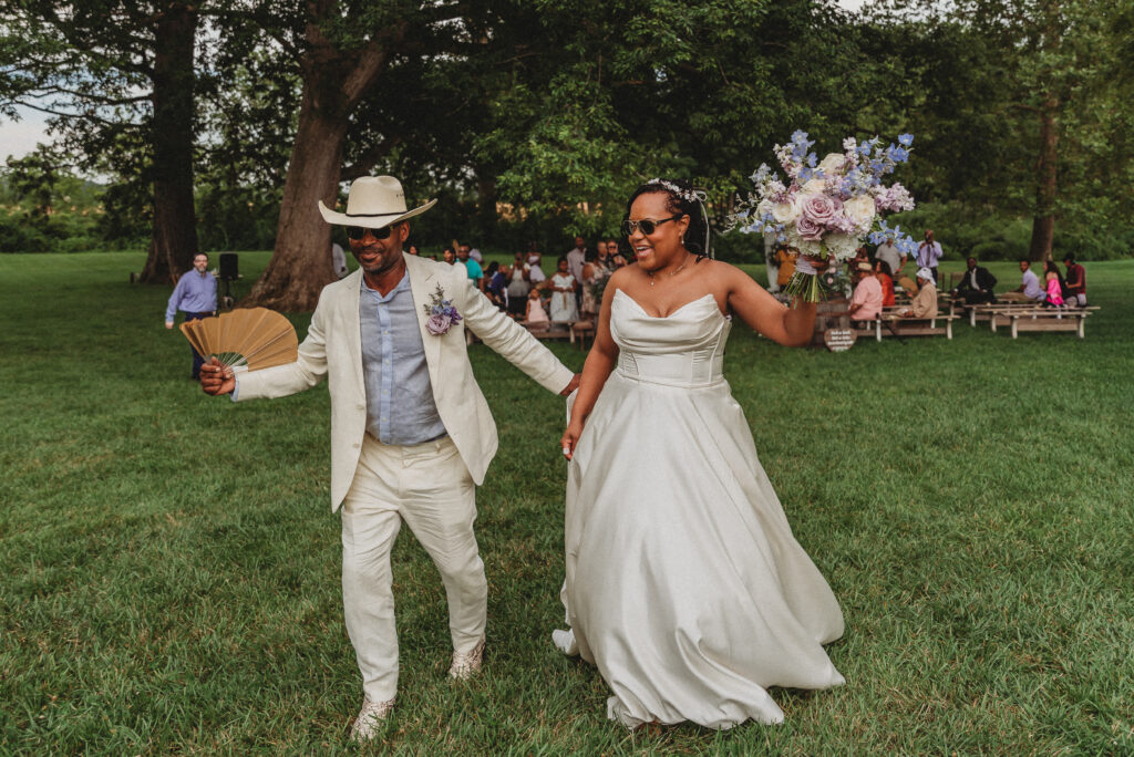 Bride and groom laughing together during Kennedy Estate wedding portraits