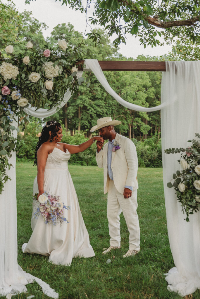 Bride and groom laughing together during Kennedy Estate wedding portraits